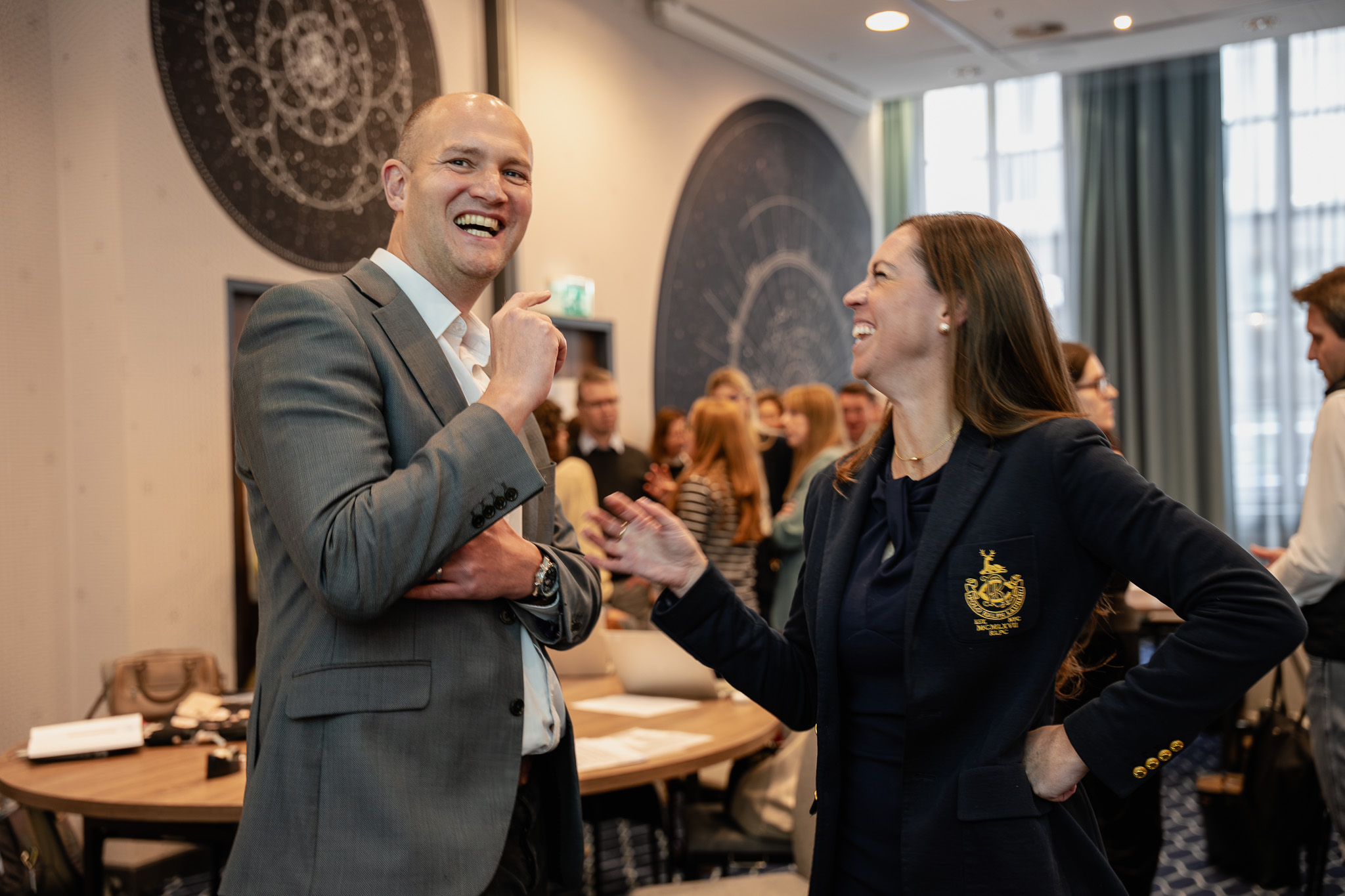 Leaders sharing a lighter moment during a workshop